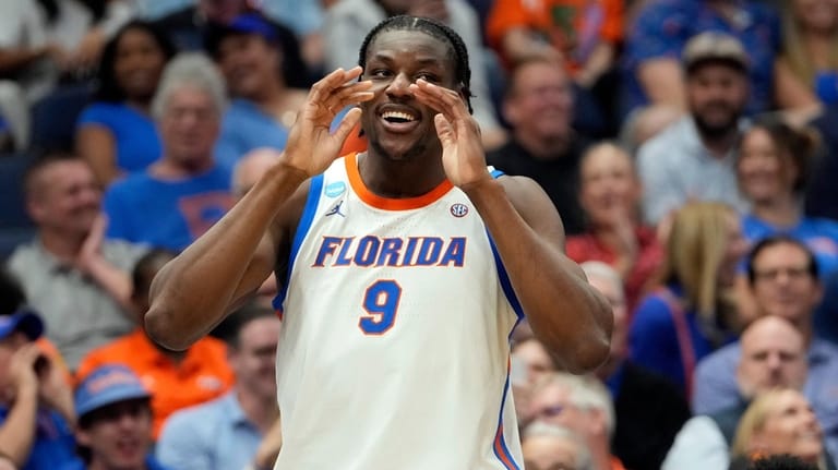 Florida center Rueben Chinyelu (9) celebrates during the second half...