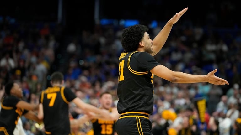 Iowa guard Kael Combs celebrates during the second half in...