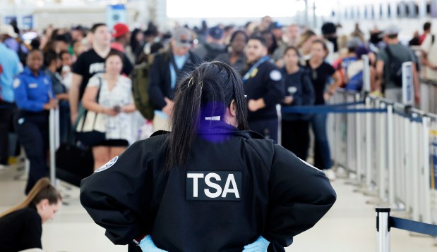 A TSA agent stands guard at a security checkpoint at Fort Lauderdale-Hollywood International Airport in Fort Lauderdale on Monday, March 23, 2026. (Carline Jean/South Florida Sun Sentinel)