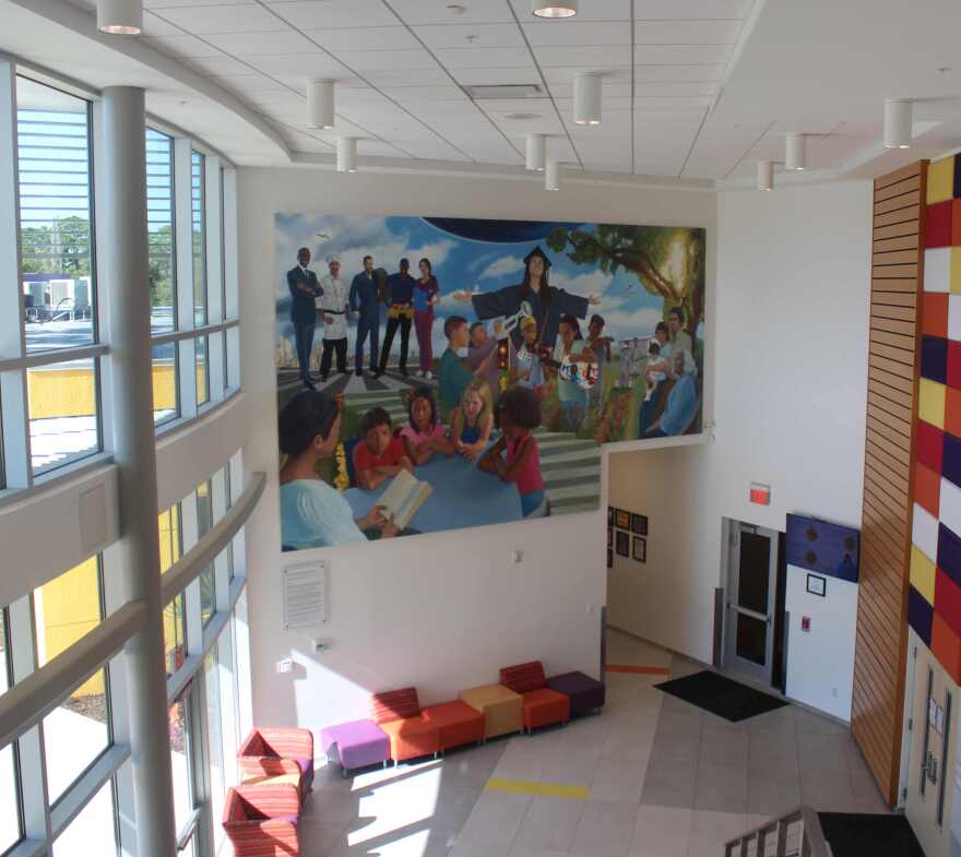The mural is located on the west wall of the lobby of the Heights Foundation Education Building.