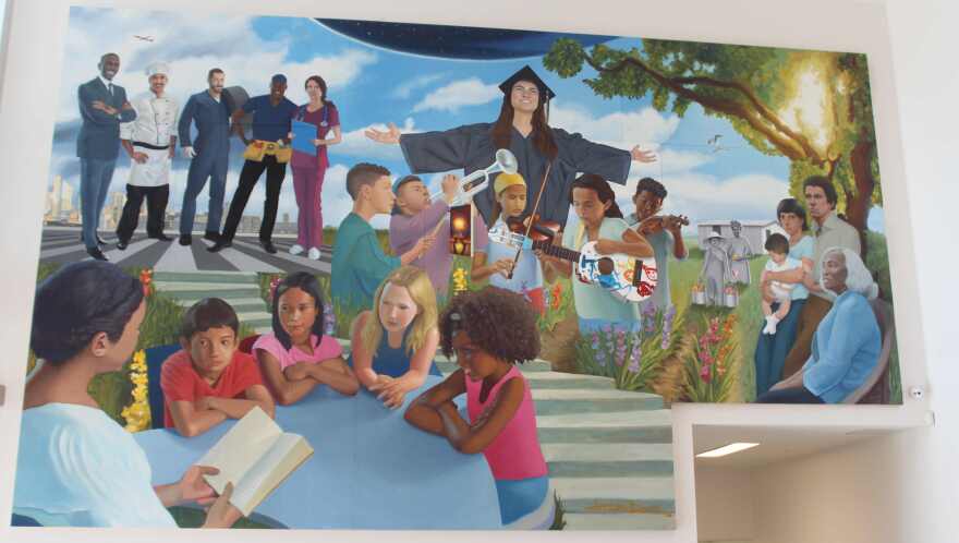 The mural is painted on 12 hand-built wood panels each measuring 12.6 by 21 feet that the artist bolted together to form a seamless composition.