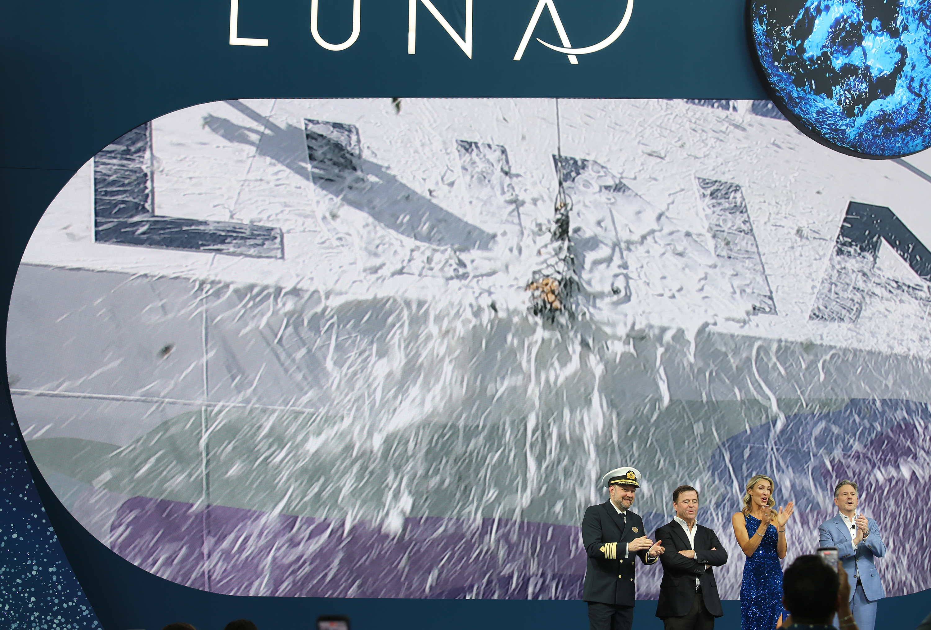 Video of a champagne bottle smashing into the hull of...