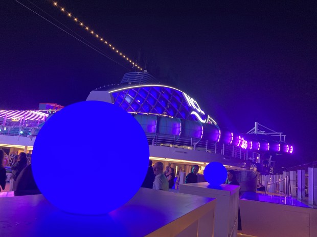 Blue lights illuminate the top decks of Norwegian Cruise Line's new ship Norwegian Luna after its arrival to PortMiami on Friday, March 27, 2026. (Richard Tribou/Orlando Sentinel)