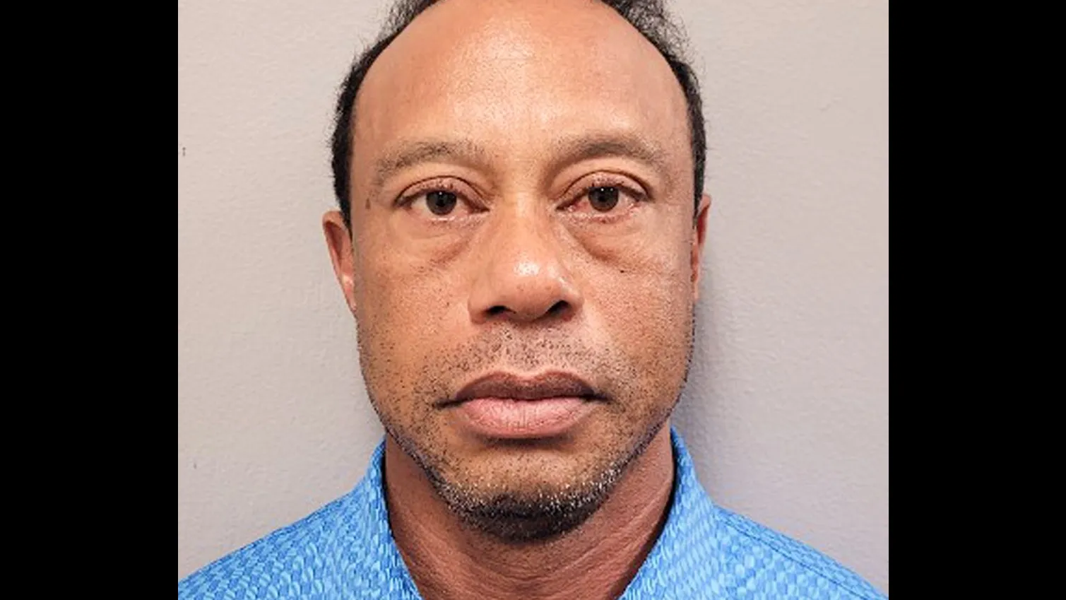 Tiger Woods mugshot, leaving jail, crash scene photos in Florida
