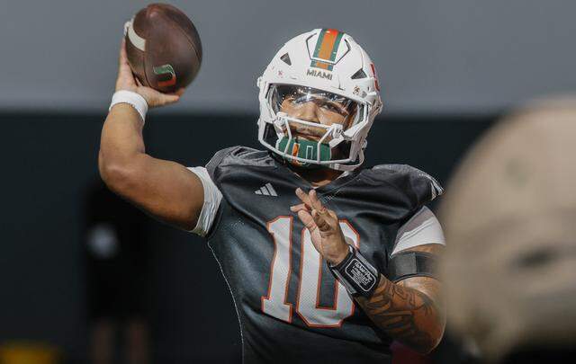 Miami Hurricanes quarterback Darian Mensah (10) throws a pass during drills at the Carol Soffer Indoor Practice Facility on the University of Miami campus in Coral Gables, Florida, on Tuesday morning, March 24, 2026.