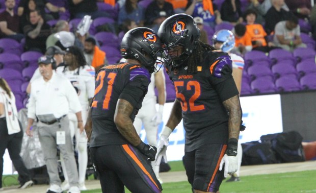 Orlando Storm defensive end Keshawn Banks celebrates after swatting down a pass with teammate Lamar Jackson during the Orlando Storm's debut UFL game Sunday night, March 29, 2026, at Inter&Co Stadium. (Chris Hays/Orlando Sentinel)