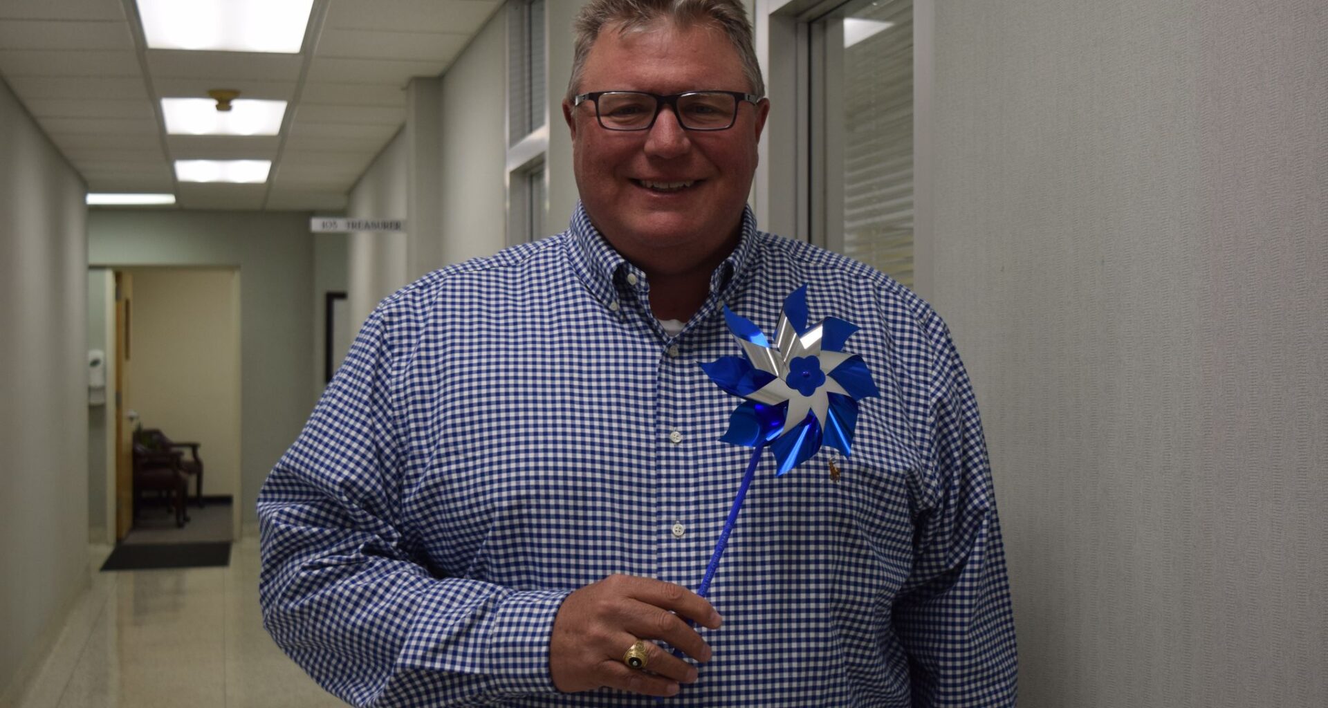 Mayor Andy Ezard holds a pinwheel. The Advocacy Network for Children, which uses the pinwheels to raise awareness of child abuse and prevention, will host an event at 10 a.m. April 10 at Jacksonville Municipal Building.