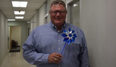 Mayor Andy Ezard holds a pinwheel. The Advocacy Network for Children, which uses the pinwheels to raise awareness of child abuse and prevention, will host an event at 10 a.m. April 10 at Jacksonville Municipal Building.