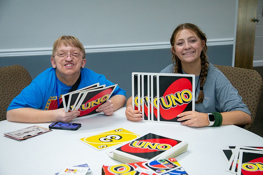 Alex Schon played Uno with his buddy at Breakaway Camp Retreat. The individuals with disabilities are with their buddies from breakfast until bedtime with each day packed with activities.