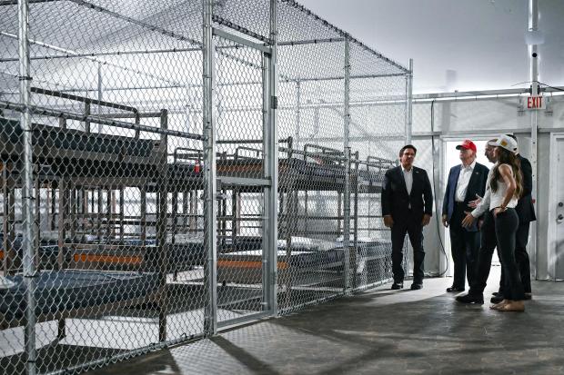 President President Donald Trump, Florida Governor Ron DeSantis, and Secretary of Homeland Security Kristi Noem tour a migrant detention center, dubbed "Alligator Alcatraz," located at the site of the Dade-Collier Training and Transition Airport in Ochopee, Florida, on July 1, 2025.