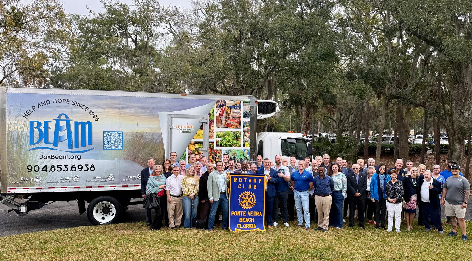 BEAM Executive Director Jeff Winkler joins members of the Ponte Vedra Beach and Jacksonville-Oceanside Rotary clubs to celebrate the new refrigerated box truck the clubs funded, allowing the nonprofit to deliver fresh food to local families in need.