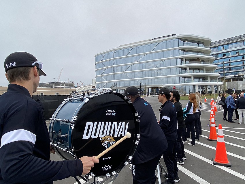 A drum line and Jacksonville Jaguars cheerleaders greeted attendees of a March 25 ceremonial opening of the team's new headquarters, One Tower Court.