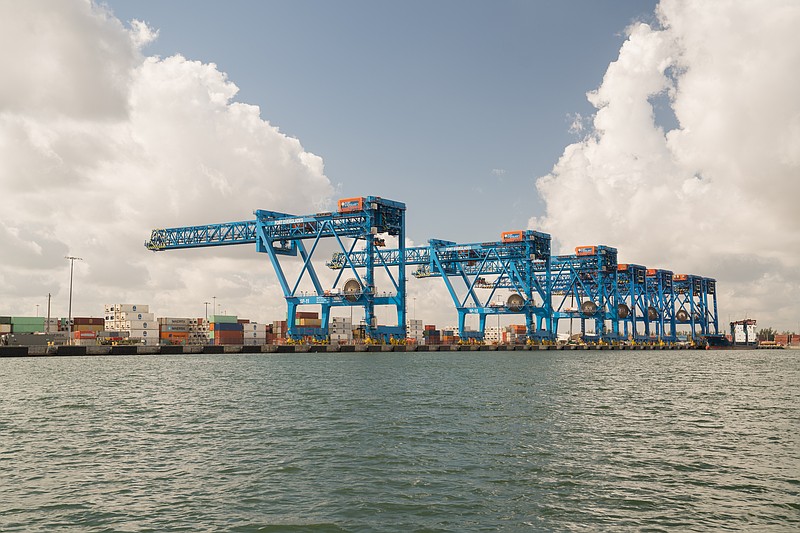 Newly built crane arms await a new generation of large container ships that would be able to enter Port Everglades more easily after the dredging.