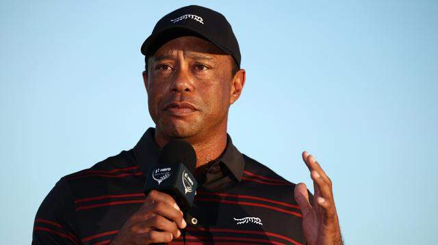 NASSAU, BAHAMAS - DECEMBER 07: Tiger Woods of the United States speaks during the trophy presentation on the 18th green after the final round of the Hero World Challenge 2025 at Albany Golf Course on December 07, 2025 in Nassau, Bahamas. (Photo by Jared C. Tilton/Getty Images)