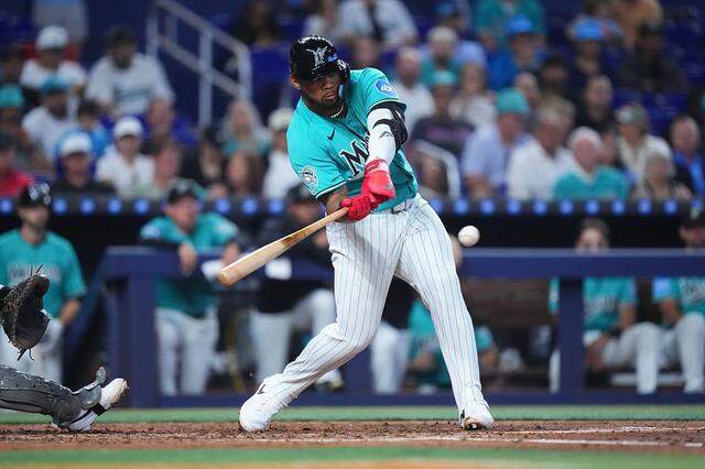 MIAMI, FLORIDA - MARCH 29: Deyvison de Los Santos #63 of the Miami Marlins hits a double in his his MLB debut game against the Colorado Rockies during the second inning at loanDepot park on March 29, 2026 in Miami, Florida. (Photo by Rich Storry/Getty Images)