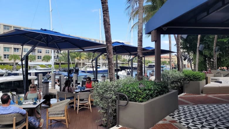 People sitting at tables at Boatyard's outdoor patio