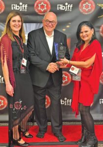 Festival co-chairs Roxana Levin (left) and Anat Mansour (right) with Starr Award honoree Lance Becatti (center).