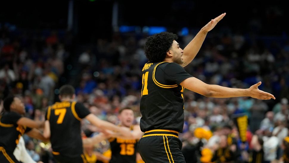 Iowa guard Kael Combs celebrates during the second half in the second round of the NCAA college basketball tournament Sunday, March 22, 2026, in Tampa, Fla. (AP Photo/Chris O'Meara)