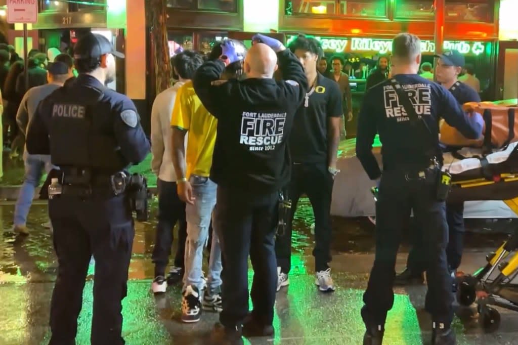 EMTs check out a person after a brawl broke out at Dicey Riley’s in Fort Lauderdale, Florida. Romaine Maurice for NY Post