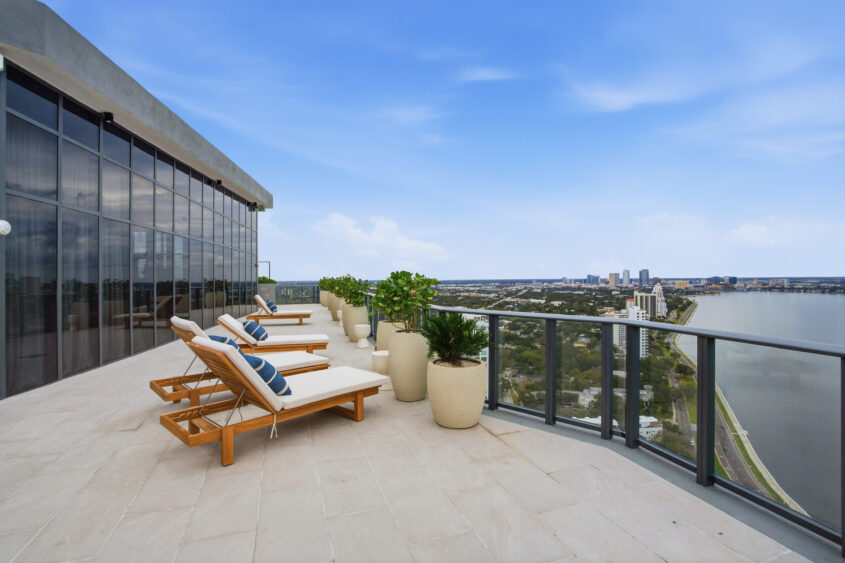 Outdoor terrace at Ritz-Carlton Residences Tampa overlooking Hillsborough Bay and Bayshore Drive skyline