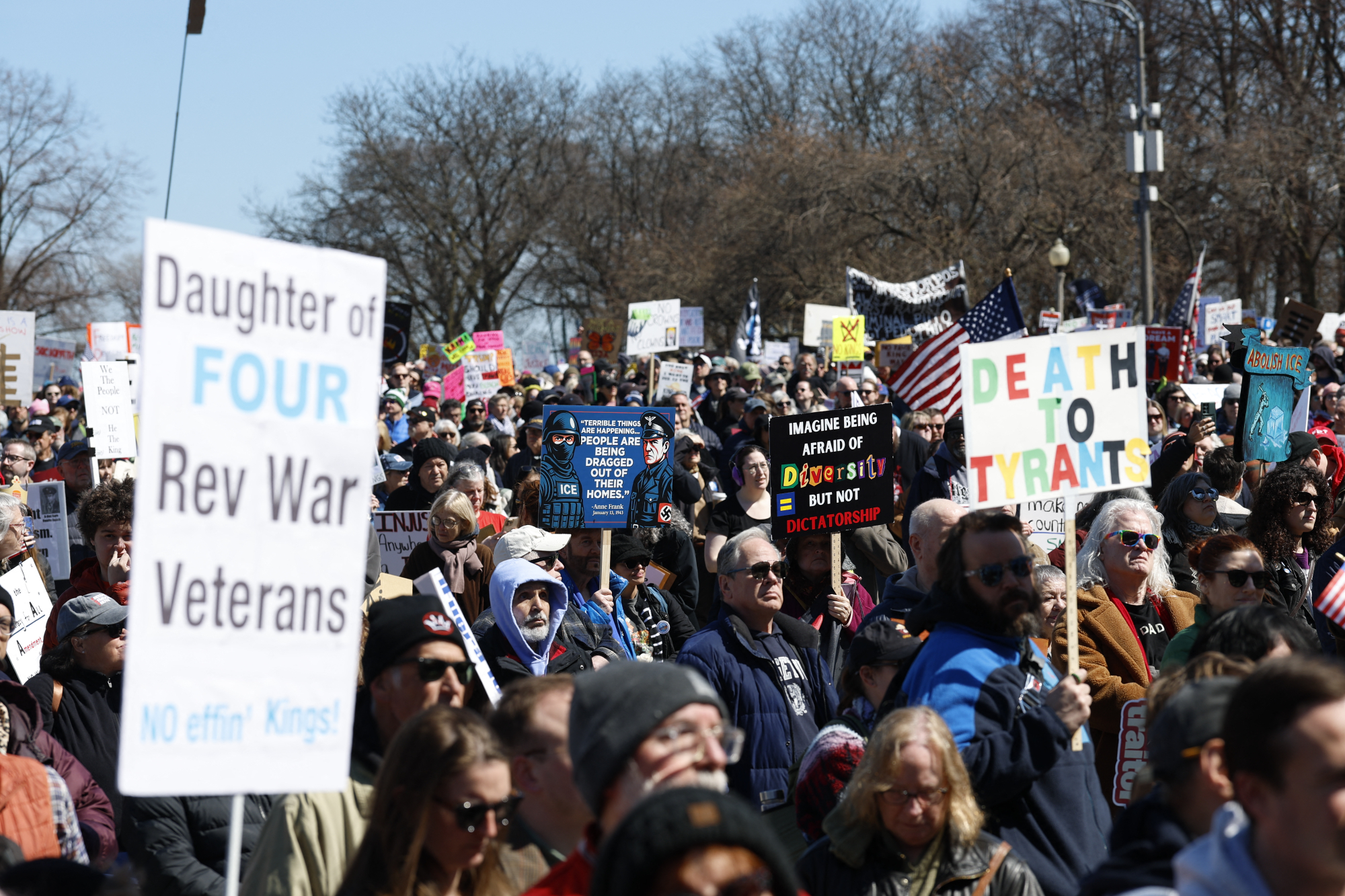A sign reads: daughter of four rev war veterans. no effin kings!
