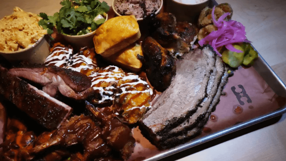 A barbecue platter with various Latin-influenced sides at West Palm Cowboy Club in West Palm Beach. The new restaurant and nightclub, featuring barbecue from Miami's Slab Daddy BBQ, has its grand opening scheduled on March 26. (Jim Rassol/Contributor)