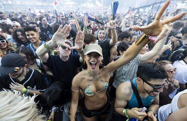 People dance and cheer as Excision performs during Ultra Music Festival’s 26th anniversary at Bayfront Park on Saturday, March 28, 2026, in downtown Miami, Fla.