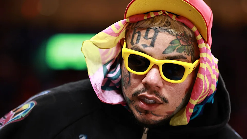 Tekashi 6ix9ine is seen during the second half of a game between the Miami Heat and the Cleveland Cavaliers at Kaseya Center on November 12, 2025 in Miami, Florida.