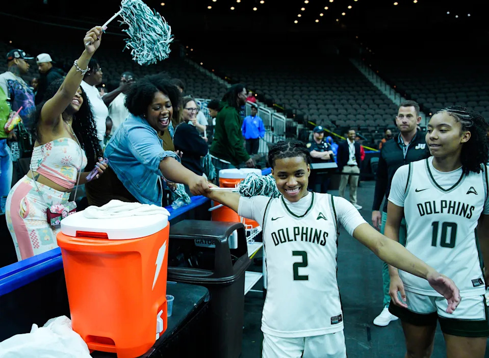 Jacksonville Dolphins guard Tatum Brown (2) celebrates with fans after defeating West Georgia 86-77 in the ASUN women’s basketball tournament Thursday March 5, 2026 at VyStar Veterans Memorial Arena in Jacksonville, Fla. [Doug Engle/Florida Times-Union]