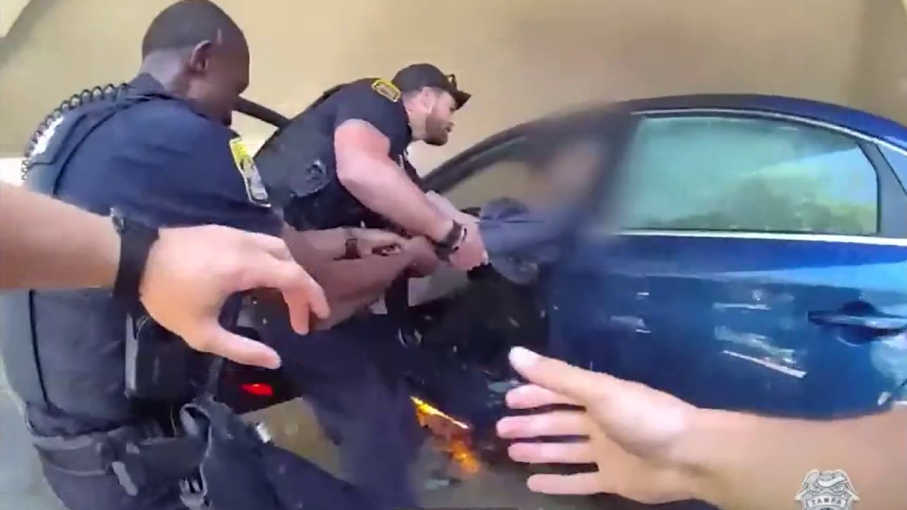 TPD officers rescue man from burning car