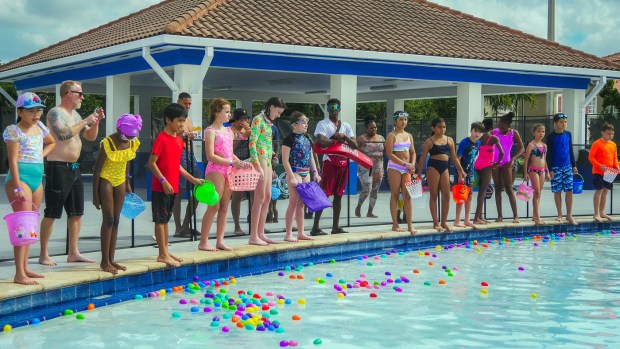 Participants wait to gather eggs in the pool at last year's Wet & Wild Egg Splash in Tamarac.