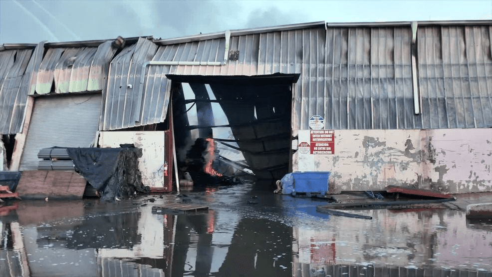 March 6, 2026 — Miami-Dade Fire Rescue Assistant Chief Jason Richard says about 100 firefighters are working to contain a large commercial fire at NW 206th Street and 47th Avenue, where crews remain on scene due to the building’s size and burning materials, while environmental agencies monitor air quality and residents with respiratory issues are urged to avoid the area. (MDFR) 