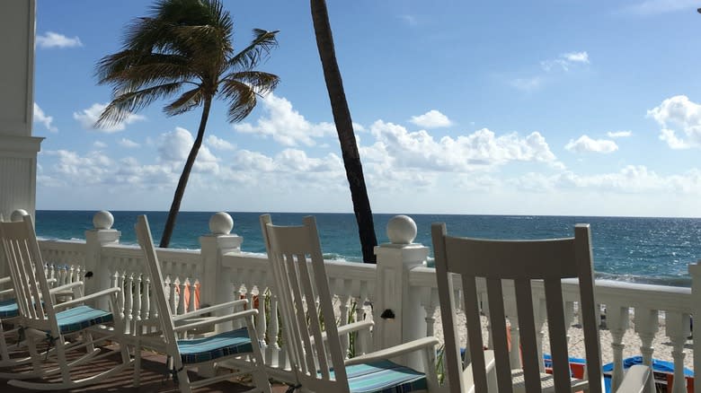 Rocking chairs overlooking the beach at the Pelican Grand Beach Resort in Fort Lauderdale