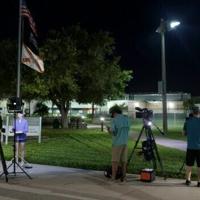 Media members report from in front of the Martin County Jail, where golfer Tiger Woods was held after being arrested on a charge of driving under the influence a car crash | News