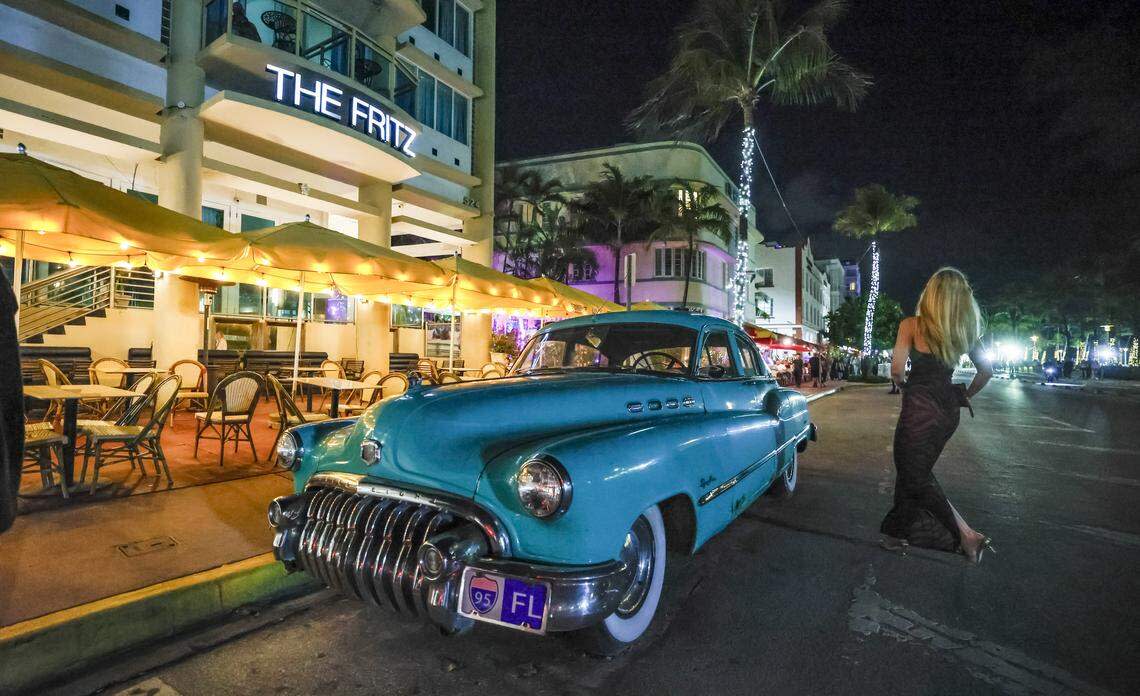 A retro car makes a statement on South Beach's Ocean Drive during spring break in Miami Beach, Florida, on Friday, March 20, 2026.