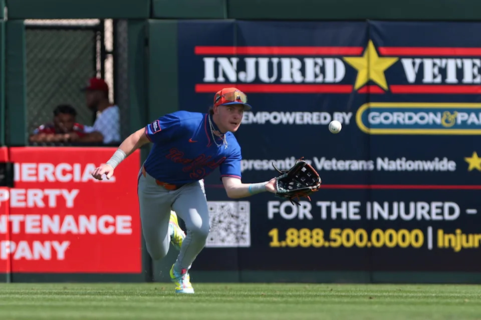 New York Mets right fielder Carson Benge (93) makes a diving catch to retire St. Louis Cardinals left fielder Nelson Velázquez (not pictured) during the second inning on Feb. 27, 2026, at Roger Dean Chevrolet Stadium.