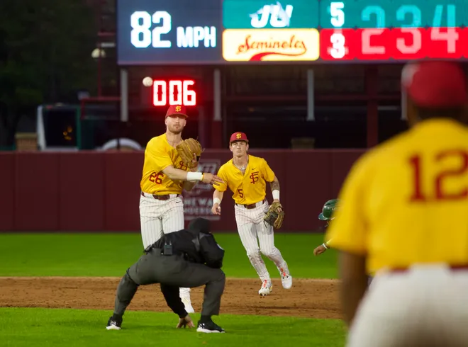 Eli Putnam throws a double play ball as FSU baseball wore their throwback “mustard” jerseys as the Seminoles hosted Jacksonville on Tuesday, March. 3, 2026 at Dick Howser Stadium