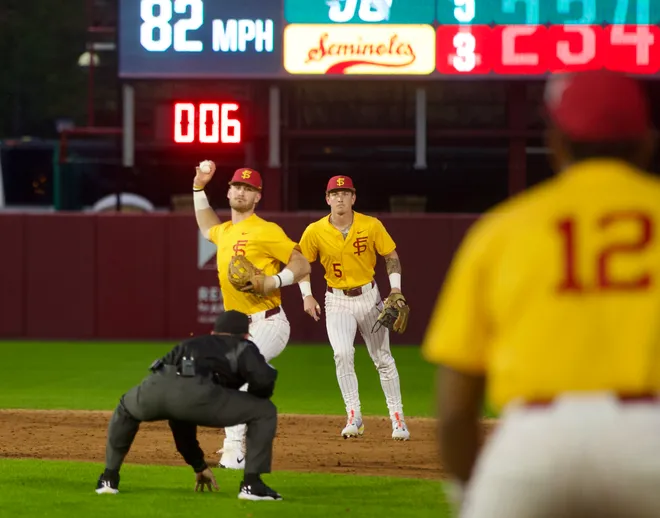Eli Putnam throws a double play ball as FSU baseball wore their throwback “mustard” jerseys as the Seminoles hosted Jacksonville on Tuesday, March. 3, 2026 at Dick Howser Stadium