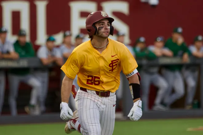 Hunter Carns watches a fly ball as FSU baseball wore their throwback “mustard” jerseys as the Seminoles hosted Jacksonville on Tuesday, March. 3, 2026 at Dick Howser Stadium