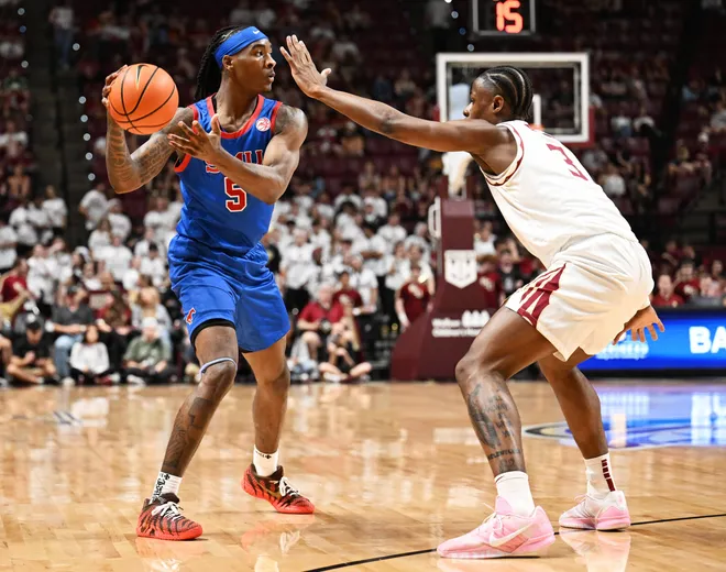 Mar 7, 2026; Tallahassee, Florida, USA; Southern Methodist Mustangs guard Jaron Pierre Jr. (5) looks to pass against Florida State Seminoles forward Thomas Bassong (3) during the first half at Donald L. Tucker Center. Mandatory Credit: Melina Myers-Imagn Images