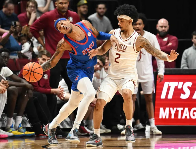 Mar 7, 2026; Tallahassee, Florida, USA; Southern Methodist Mustangs forward Corey Washington (3) is fouled by Florida State Seminoles guard Cam Miles (2) during the first half at Donald L. Tucker Center. Mandatory Credit: Melina Myers-Imagn Images