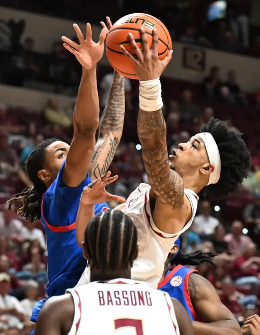 Mar 7, 2026; Tallahassee, Florida, USA; Florida State Seminoles guard Cam Miles (2) goes up for a shot during the first half against the Southern Methodist Mustangs at Donald L. Tucker Center. Mandatory Credit: Melina Myers-Imagn Images