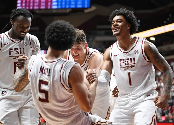 Mar 7, 2026; Tallahassee, Florida, USA; Florida State Seminoles guard Kobe MaGee (5) is helped up by guard Robert McCray (6), center Alex Steen (25) and guard Martin Somerville (1) during the second half against the Southern Methodist Mustangs at Donald L. Tucker Center. Mandatory Credit: Melina Myers-Imagn Images