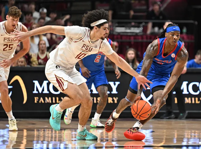 Mar 7, 2026; Tallahassee, Florida, USA; Southern Methodist Mustangs guard Jaron Pierre Jr. (5) grabs a loose ball before Florida State Seminoles guard Lajae Jones (10) during the first half at Donald L. Tucker Center. Mandatory Credit: Melina Myers-Imagn Images