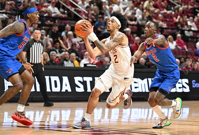 Mar 7, 2026; Tallahassee, Florida, USA; Florida State Seminoles guard Cam Miles (2) goes up for a shot during the first half against the Southern Methodist Mustangs at Donald L. Tucker Center. Mandatory Credit: Melina Myers-Imagn Images