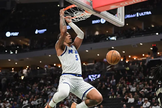 Mar 8, 2026; Milwaukee, Wisconsin, USA; Orlando Magic forward Paolo Banchero (5) dunks the basketball in the third quarter against the Milwaukee Bucks at Fiserv Forum.