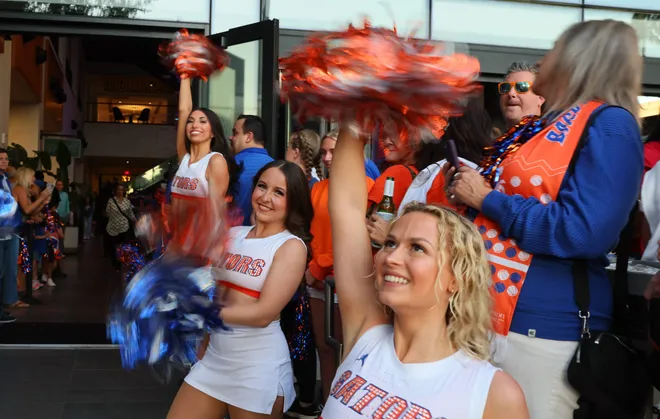Florida fans and cheerleaders get fired up before the NCAA March Madness opening round at JW Marriott in Tampa, FL on Friday, March 20, 2026. Several hundred people cheered Florida as they left to board the bus for to go to the arena. [Alan Youngblood/Gainesville Sun]