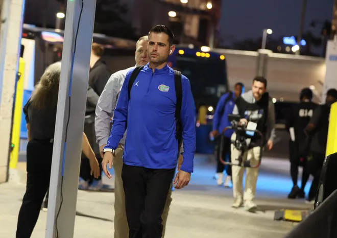 Florida head coach Todd Golden and the rest of the gators arrive at Benchmark International Arena before the NCAA March Madness opening round at JW Marriott in Tampa, FL on Friday, March 20, 2026. Several hundred people cheered Florida as they left the JW Marriott to board the bus for to go to the arena. [Alan Youngblood/Gainesville Sun]