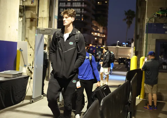 Florida center Olivier Rioux (32) and the rest of the gators arrive at Benchmark International Arena before the NCAA March Madness opening round at JW Marriott in Tampa, FL on Friday, March 20, 2026. Several hundred people cheered Florida as they left the JW Marriott to board the bus for to go to the arena. [Alan Youngblood/Gainesville Sun]