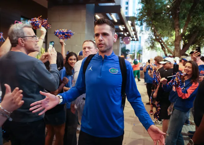 Florida head coach Todd Golden greets fans before the NCAA March Madness opening round at JW Marriott in Tampa, FL on Friday, March 20, 2026. Several hundred people cheered Florida as they left to board the bus for to go to the arena. [Alan Youngblood/Gainesville Sun]